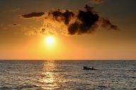 Fishing boat in sunrise