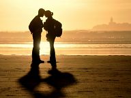 Boy and girl on the beach of the Atlantic