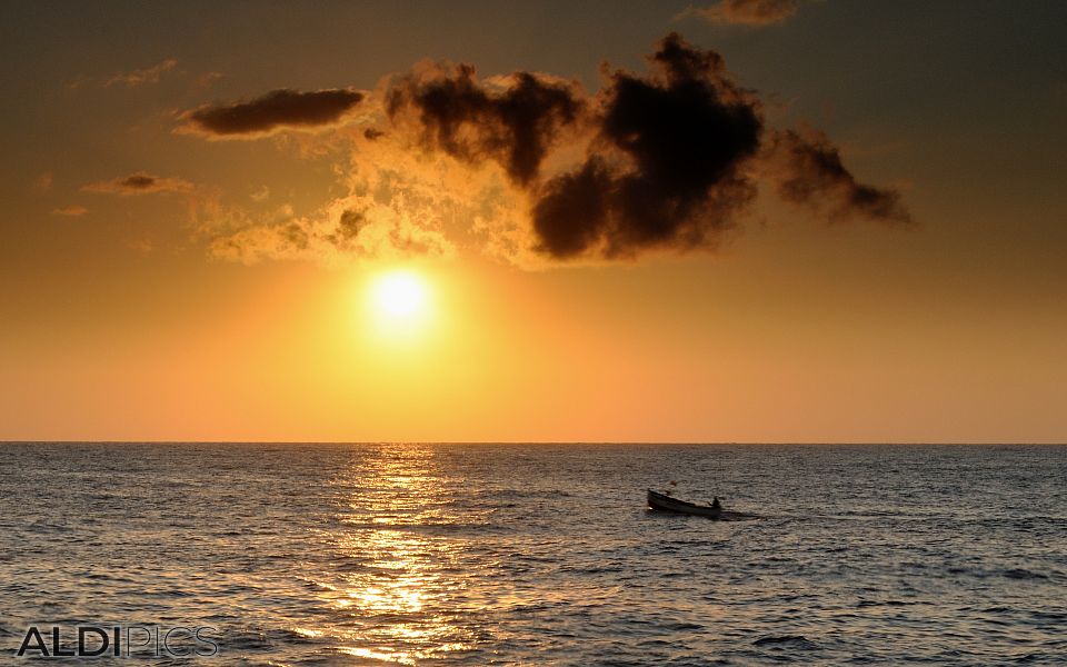 Fishing boat in sunrise