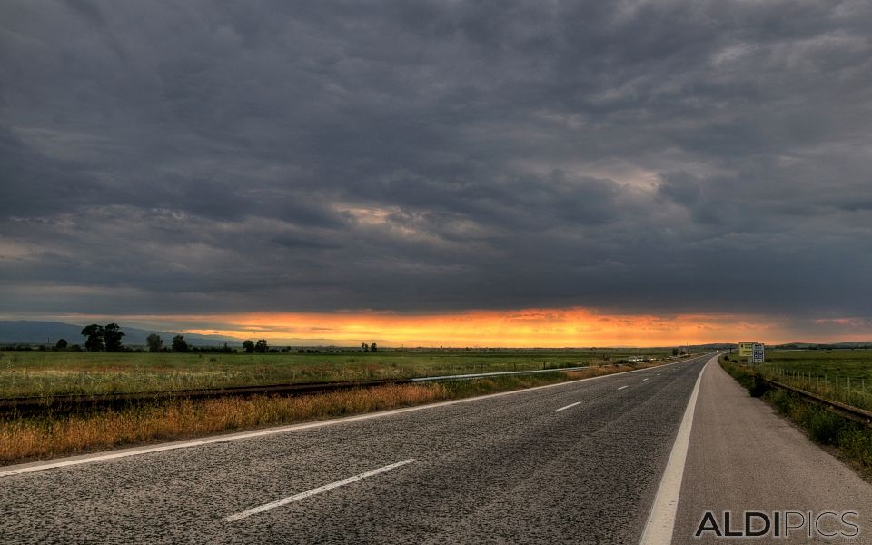 Sunset over the road